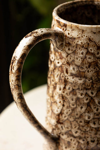 Close-up of the handle of the Large Mottled Brown Jug.