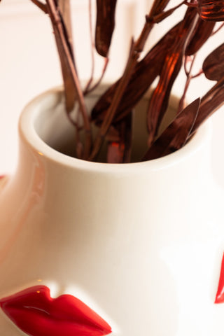 Close-up of the top of the Large Red Kiss Me Lips Flower Vase.