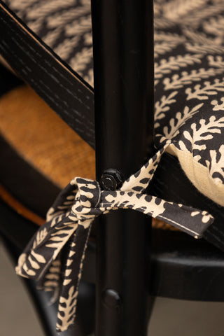 Close-up of the ties of the Leaf Print Seat Cushion.