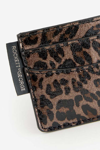 Close-up of one side of the Leopard Print Card Holder with the Rockett St George logo.