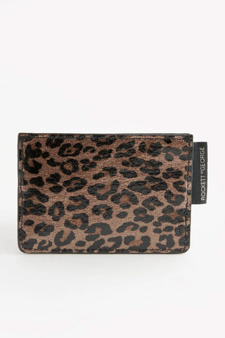 The reverse side of the Leopard Print Card Holder in front of a white background.