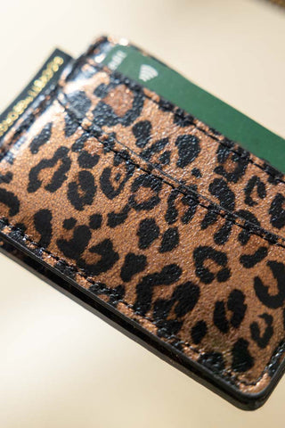 Close-up of the Leopard Print Card Holder with cards inside.