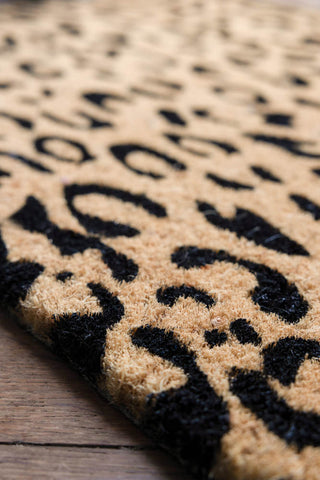 Close-up of the Leopard Print Coir Doormat.