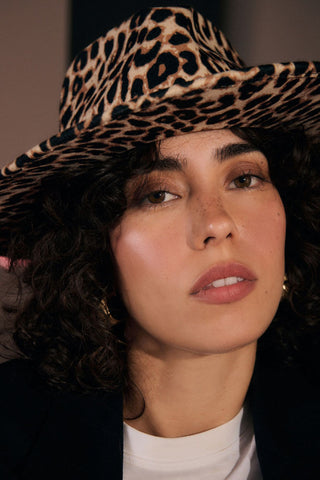 The Leopard Print Fedora worn by a model.