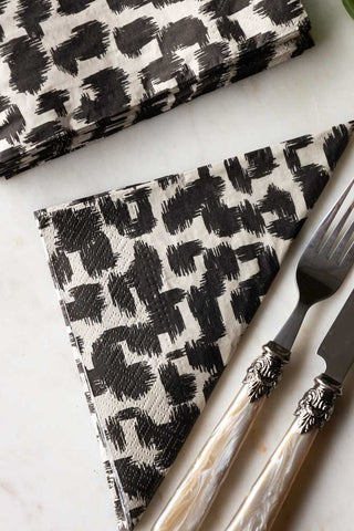 Close-up of the Abstract Leopard Print Napkins on a white surface with some cutlery.