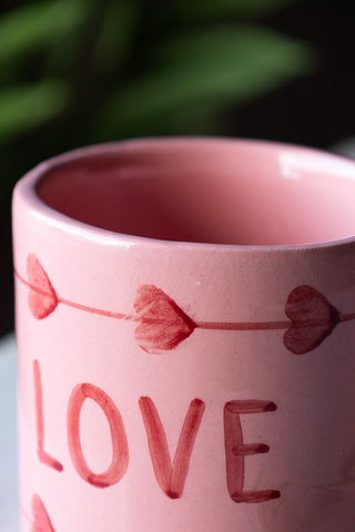 Close-up of the rim of the Love Hand-Painted Cappuccino Mug.