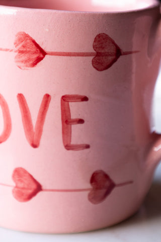 Detail shot of the design on the Love Hand-Painted Cappuccino Mug.