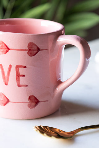 Detail shot of the handle of the Love Hand-Painted Cappuccino Mug.