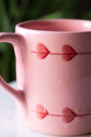 Close-up of the heart design on the Love Hand-Painted Cappuccino Mug.