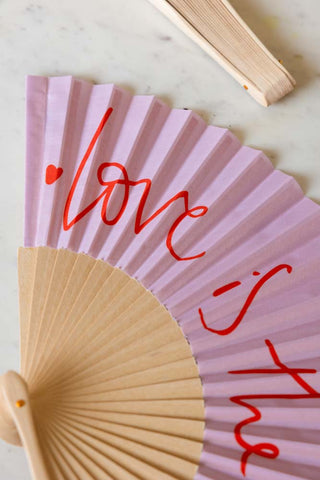 Detail shot of the Love Is The Drug Pink & Red Fan.