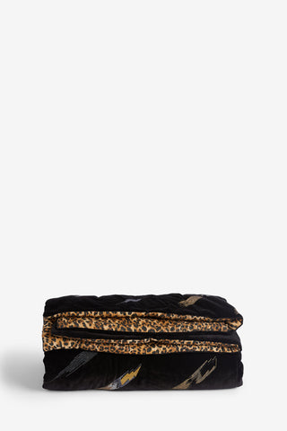 The Reversible Black Lovestruck & Leopard Print Throw folded in front of a neutral background.