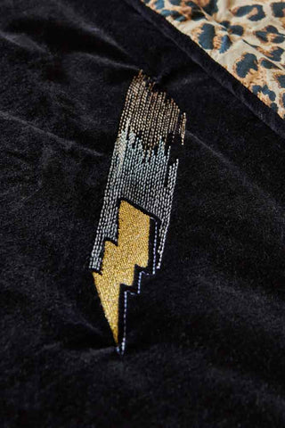 Close-up of the lightning design on the Reversible Black Lovestruck & Leopard Print Throw.