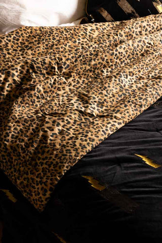 Close-up of the leopard print side of the Reversible Black Lovestruck & Leopard Print Throw.