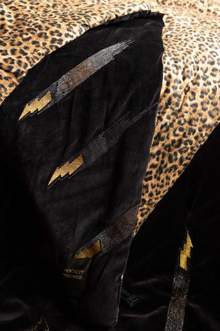 Close-up of the motif of the Reversible Black Lovestruck & Leopard Print Throw.