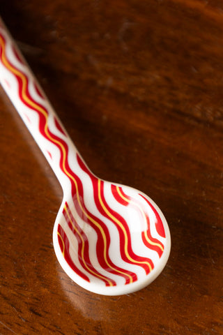 Close-up of the Made With Love Red Striped Spoon.