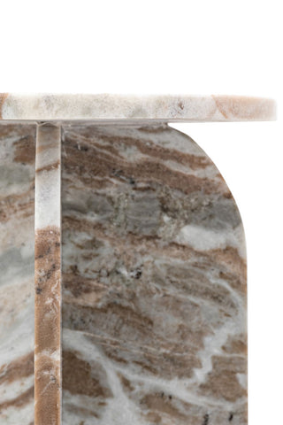 Detail shot of the top of the White Marble Round Side Table, in front of a white background.