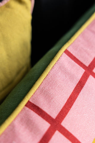 Close-up of the piping of the Merci Cushion.