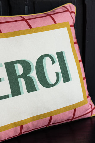 Close-up of the design on the Merci Cushion.