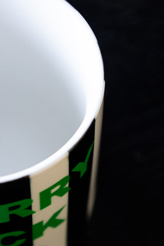 Close-up of the rim on the Merry Fuck This Stripe Mug.