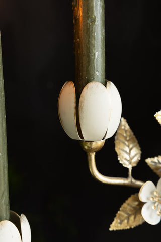 Close-up of the base of one of the candle holders on the Metal Floral Candelabra.