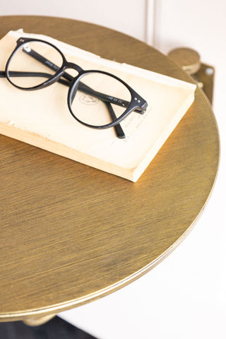 Close-up of the Metal Table & Wall Shelf seen from above, with a book and pair of glasses on.