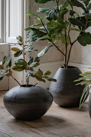 The Mexica Patterned Large Vase displayed with a larger version, styled with plants inside.