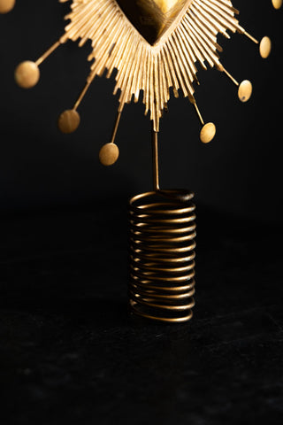 Detail shot of the base of the Milagro Heart Christmas Tree Topper.