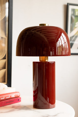 Close up of deep red, glossy table lamp