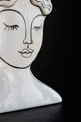 Detail shot of the face on the Peaceful Monochrome Lady Vase.