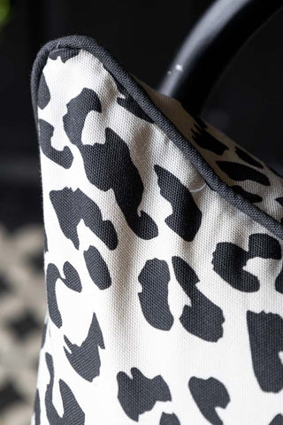 Detail shot of the corner/piping of the Monochrome Leopard Cushion.