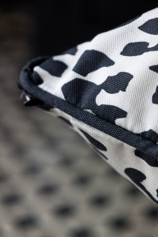 Close-up of the corner of the Monochrome Leopard Cushion.