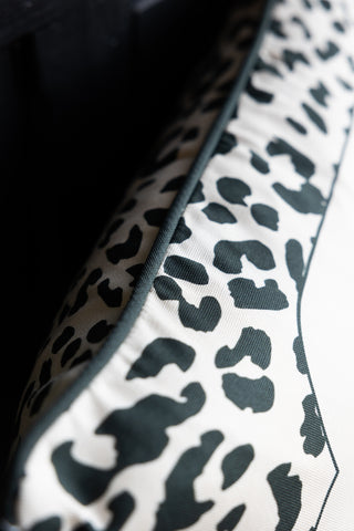 A detailed image showing the piping on theThe Monochrome Leopard Sit The Fuck Down Cushion