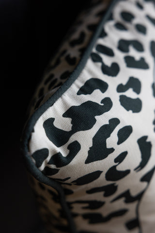 A detailed image showing the corner of The Monochrome Leopard Sit The Fuck Down Cushion