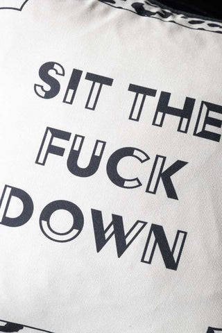 Detail shot of the text on the Monochrome Leopard Sit The Fuck Down Cushion.