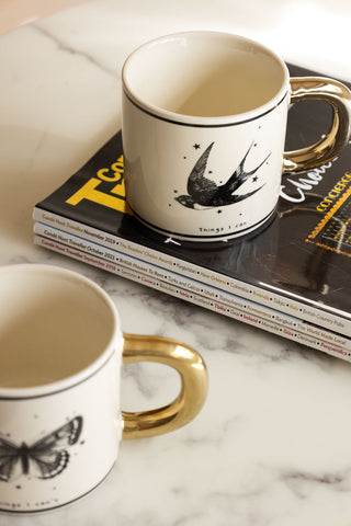 Monochrome Set of 2 Tattoo Mugs on magazine