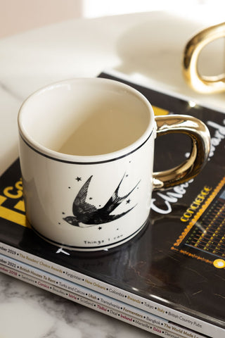 Monochrome Set of 2 Tattoo Mugs on magazine 