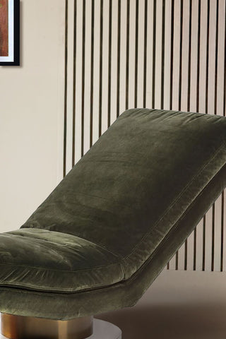 A detail look at the green velvet on the chaise longue in green.