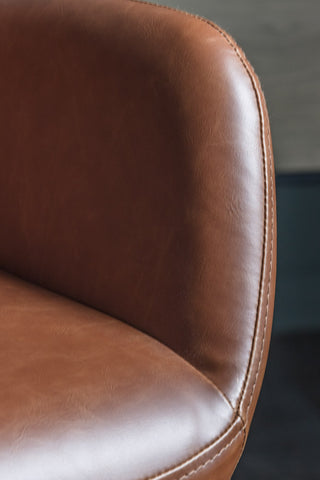 Close-up of the arm of the Moulded Swivel Chair Mocha.