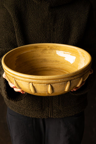 Photo of the Mustard Ceramic Serving/Fruit Bowl held in hands
