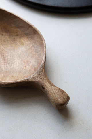 Detail shot of the handle of the Natural Wood Carved Serving Dish.