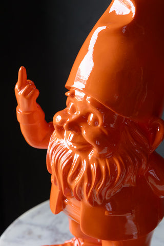 Close-up of orange fibreglass gnome's face, beard and hat