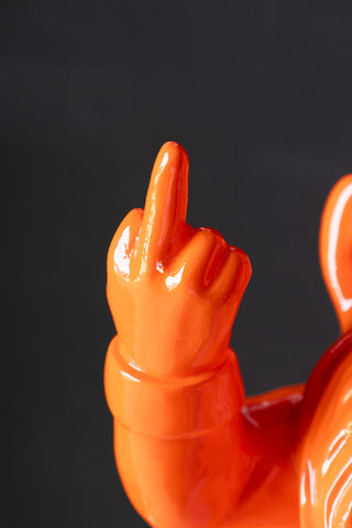 Close-up of gnome's hand and rude gesture