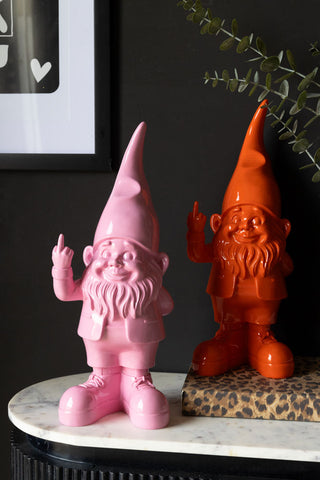 Two gnomes, one pink,  one orange, facing forward and making rude gestures with one finger up