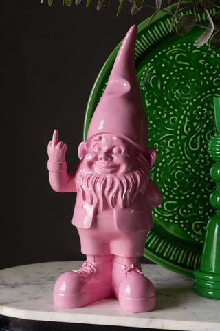 The Fabulous Pink Naughty Gnome styled with a green tray and candlestick holder.