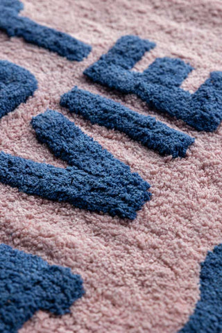 Close-up of the Navy & Pale Pink C'est La Vie Bath Mat.