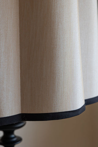 Close-up of the Oyster Scalloped Easyfit Lampshade styled on a lamp base.