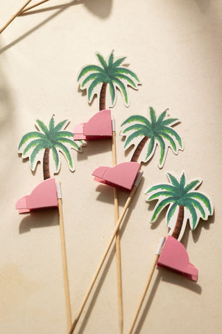 The Palm Tree Party Toothpicks laid flat on a neutral surface.