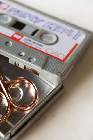 Detail shot of the Party Mix Cassette Tape Storage Tin with the lid off.