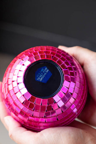 Pink decision ball facing up that says 'it's time to get your groove on'.