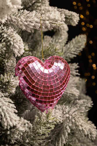 The Pink Disco Heart Christmas Tree Decoration hanging in the branches of a Christmas tree.